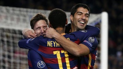 Lionel Messi, Luis Suarez and Neymar celebrate during their Champions League win on Tuesday night over AS Roma in Barcelona. Paul Hanna / Reuters