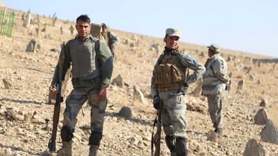 Afghan security officials patrol during an operation against ISIL militants in the district of Khogiyani, in the eastern province of Nangarhar, on December 10, 2017. Ghulamullah Habibi / EPA