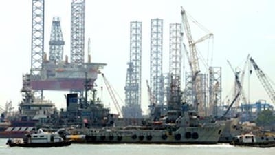 A jack-up rig, an offshore oil and gas drilling platform, undergoes repair works at a shipyard in Singapore.
