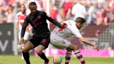Bayern's Leroy Sane, left, and Cologne's Jonas Hector challenge for the ball. AP