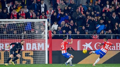 Girona's Savio Moreira scores his team's second goal against Atletico. AFP