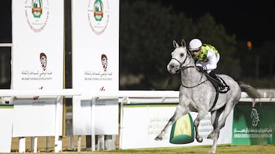 Silvestre de Sousa rides Sha’Red to the win in the Group 1 Liwa Oasis . Lee Hoagland / The National