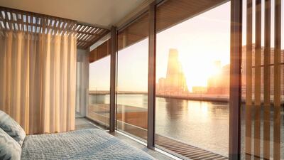 The master bedroom is on the upper level of the two-storey water homes