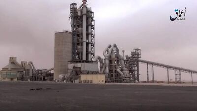 This image made from video published online by Amaq News Agency of the ISIL group shows a cement factory where in a brazen assault near the Syrian capital. The extremist group snatched up to 300 cement workers and contractors from their workplace northeast of Damascus on April 7, 2016, according to state news agency Sana. (Video via AP)