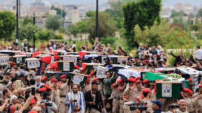 Houthi fighters carry the coffins of those killed last week in Israeli strikes on Yemen's capital Sanaa. Reuters