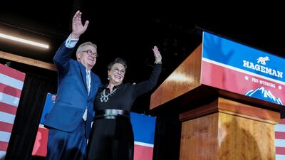 The winning candidate Harriet Hageman celebrates with her husband John Sundahl. Reuters