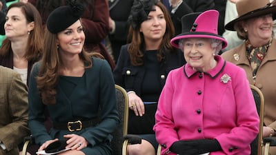 Queen Elizabeth II and Catherine watch a fashion show at De Montfort University, Leicester, in March 2012, during the Queen's Diamond Jubilee tour of the UK