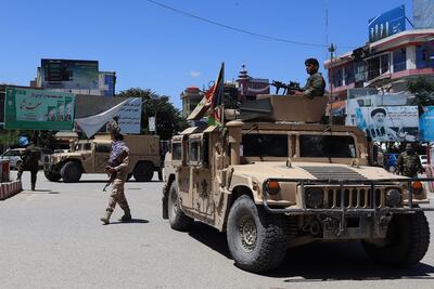 Afghan security forces sit in a Humvee vehicle amid ongoing fighting between Taliban militants and Afghan security forces in Kunduz on May 19, 2020. AFP