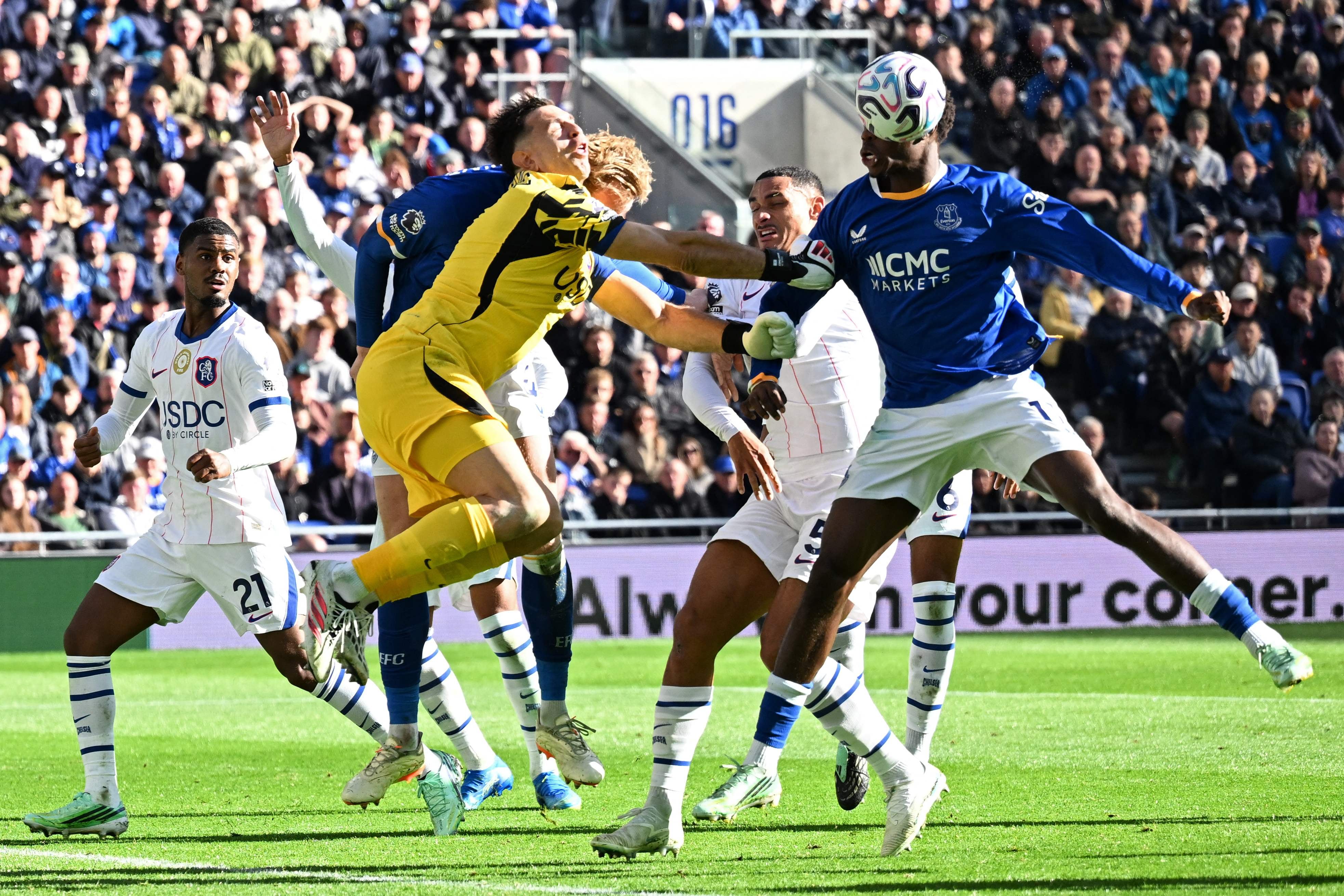 Chelsea goalkeeper Emi Martinez and Everton's Jarrad Branthwaite clash heads. AFP