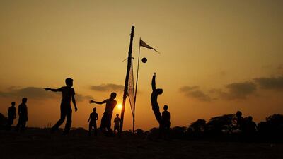Indian boys play volleyball on the banks of the Daya River on the outskirts of the eastern Indian city of Bhubaneswar. Biswaranjan Rout / AP Photo