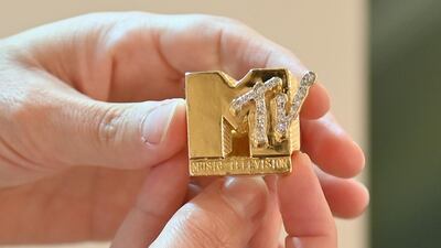 Fab 5 Freddy's gold and diamond 'MTV' ring is displayed during a press preview at Sotheby's for their Hip-Hop auction. AFP