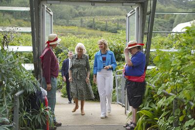 Queen Consort Camilla and show presenter Fiona Bruce walk into the Eden Project in Cornwall. PA