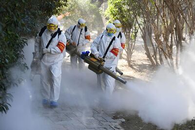 Members of a police sanitation team spraying disinfectant as a preventive measure against the spread of the the coronavirus in Bozhou, China. Getty Images