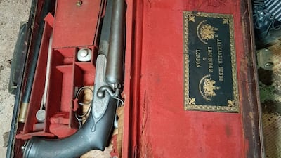 A gold-plated pistol found in the late ruler's armoury. Photo: Kazim Ali Khan