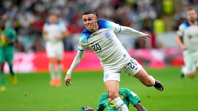 England's Phil Foden evades being tackled by Senegal's Youssouf Sabaly. PA
