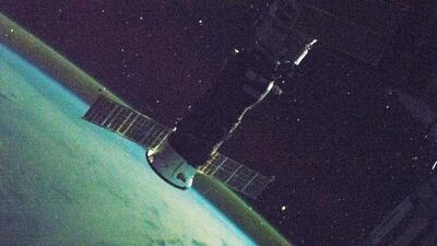 The International Space Station, pictured with Russia's ISS Progress 77 cargo craft attached to the Pirs docking compartment, orbits into a sunset 270 miles above the South Pacific on February 21, 2021. Nasa