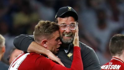 Klopp hugs Henderson. Reuters