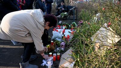 Mourners place candles, notes and flowers at the entrance to the zoo in Krefeld, Germany, where about 30 animals died in a fire. EPA