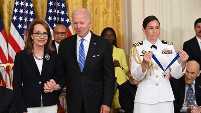 Mr Biden awards former Congresswoman Ms Giffords, who was shot at a campaign event in Tucson. AFP