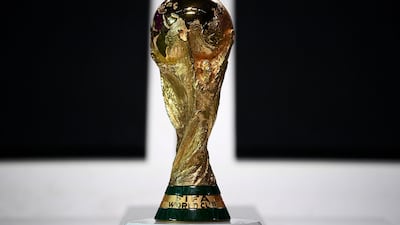 A picture taken on March 31, 2022 shows the World Cup Trophy during the FIFA Congress in the Qatari capital Doha. - FIFA launched the 2022 World Cup ball for the finals in Qatar, promising it would travel faster in the air than any ball in the history of the competition. The ball made by Adidas is called Al Rihla, which means "the journey" in Arabic, and its design "is inspired by the culture, architecture, iconic boats and flag of Qatar", FIFA said in a statement. (Photo by FRANCK FIFE / AFP)