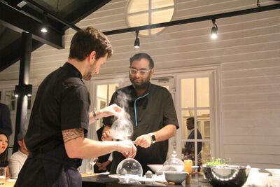 Chef Gaggan and an assistant prepare his surprise 'charcoal' dish. Photo: John Brunton