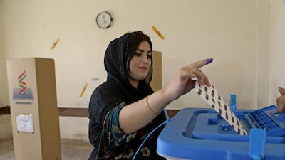 A Kurdish woman in traditional clothes prepares to vote during the Kurdistan parliamentary election at a polling station in Erbil, the capital of the Kurdistan Region in Iraq. With over three million people eligible to vote, the semi-autonomous region is voting on its parliamentary elections a year after a failed bid for independence from Iraq. EPA
