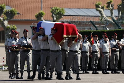 French military personnel carry a coffin during a tribute ceremony to honour a French peacekeeper killed in Lebanon. EPA