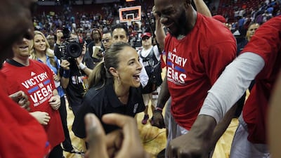 San Antonio Spurs coach Becky Hammon, centre, celebrates with her team after they defeated the Phoenix Suns in an NBA summer league championship game in Las Vegas on July 20, 2015. John Locher / AP Photo