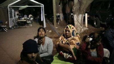 Family members of inmates who died during a fire in the Comayagua farm prison wait outside a morgue in Tegucigalpa, the Honduran capital, for news of survivors of the world's deadliest prison fire in a century.