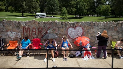 Fans wait in line outside Graceland, Elvis Presley's Memphis home. Fans from around the world are at Graceland for the 40th anniversary of his death. Brandon Dill / AP photo