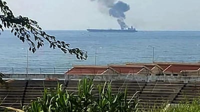 A handout picture released by the official Syrian Arab News Agency (SANA) on April 24, 2021, shows smoke billowing from a tanker off the coast of the western Syrian city of Baniyas. AFP