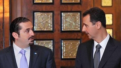 The Lebanese prime minister Saad al Hariri, left, with the Syrian president Bashar Assad ahead of a visit to Washington.