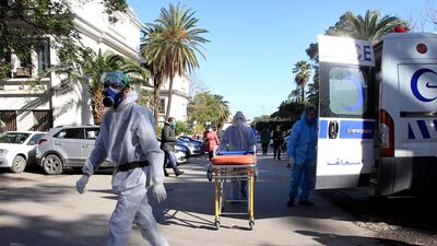 Medical workers arrive at the Mustapha Pacha hospital in Algiers. The Algerian government has decided on Monday to extend for an additional period of 15 days the partial lockdown measure in 34 provinces as from Dec. 2, said a statement from the Prime Minister's services. The extension is part of measures to manage and curb the health crisis caused by the COVID-19. AP