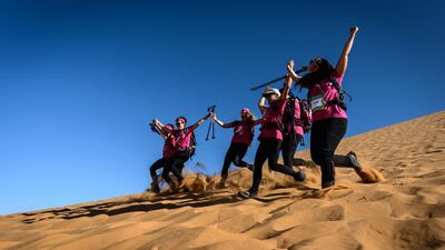 They carry just a 60-litre backpack into which they put their own trash and any other trash that they can collect on their way through the dunes. AFP