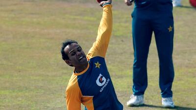 Pakistan's Nauman Ali bowls as team head coach Misbah-ul-Haq watches during a practice session at the Rawalpindi Cricket Stadium. AFP