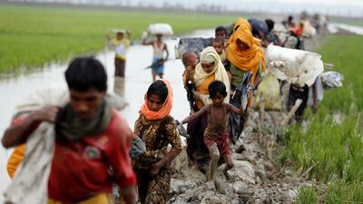 Rohingya refugees cross the Bangladesh-Myanmar border. Mohammad Ponir Hossain / Reuters