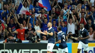Would you call in sick to watch Karim Benzema, left, and his French teammates play at the World Cup in Brazil? Philippe Hugen / AFP Photo