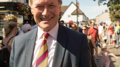 Sir David Amess attends the UK's Old Leigh Regatta in 2019. Alamy