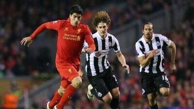 Newcastle United’s Fabrizio Coloccini chases Liverpool’s Luis Suarez. The Argentine defender was later sent off for a challenge on the Uruguayan.