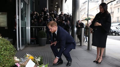 Prince Harry leaves a bouquet tribute for the 50 victims of the Christchurch shooting. AFP