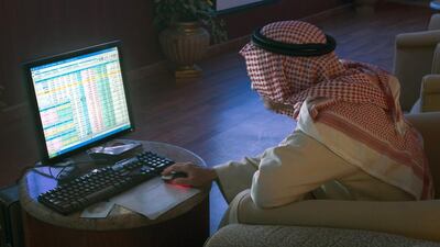 An investor tracks Saudi share price movements on a computer screen. The benchmark Tadawul All Share Index is up 16.3 per cent so far this year. Waseem Obaidi / Bloomberg NEws