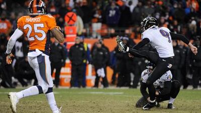 Justin Tucker kicks the winning field goal for Baltimore against the Denver Broncos.