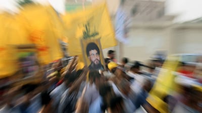 Bahraini protesters hold yellow flags of the Lebanese Hezbollah movement in 2008. AFP