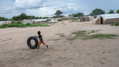 An internally displaced child plays with a car tire in the Tara Tara district of Matuge, northern Mozambique. AFP