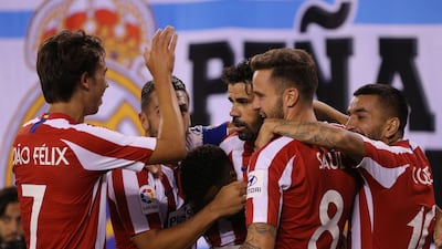 Diego Costa, centre, is congratulated on one of his four goals for Real. Reuters