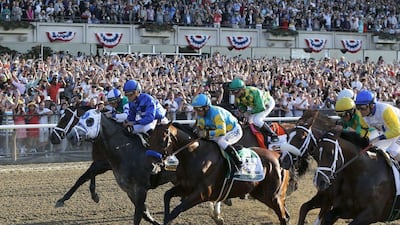 American Pharoah, No 5, with jockey Victor Espinoza breaks out of the starting gate at the start of the 147th running of the Belmont Stakes horse race at Belmont Park, Saturday, June 6, 2015, in Elmont, N.Y. American Pharoah won the race to become the first horse to win the Triple Crown in 37 years.(AP Photo/Julio Cortez)
