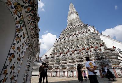 Visitors tour Wat Arun, also known as Temple of Dawn, in Bangkok, a day after Thailand restarted its 'Test & Go' programme. EPA