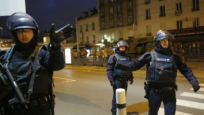 Police forces prepare in Saint-Denis, a northern suburb of Paris on Wednesday. Christophe Ena / AP