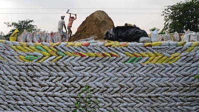 Labourers building a motorway in Jalandhar, India. AFP