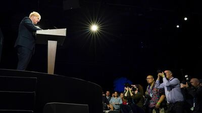 Mr Johnson delivers his leader's keynote speech during the Conservative Party conference at Manchester Central Convention Complex on October 6.
